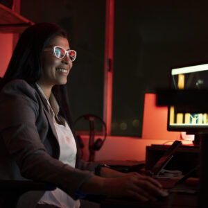 young businesswoman using a computer during a late night at work