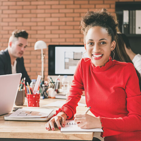 Black businesswoman in office with her colleagues