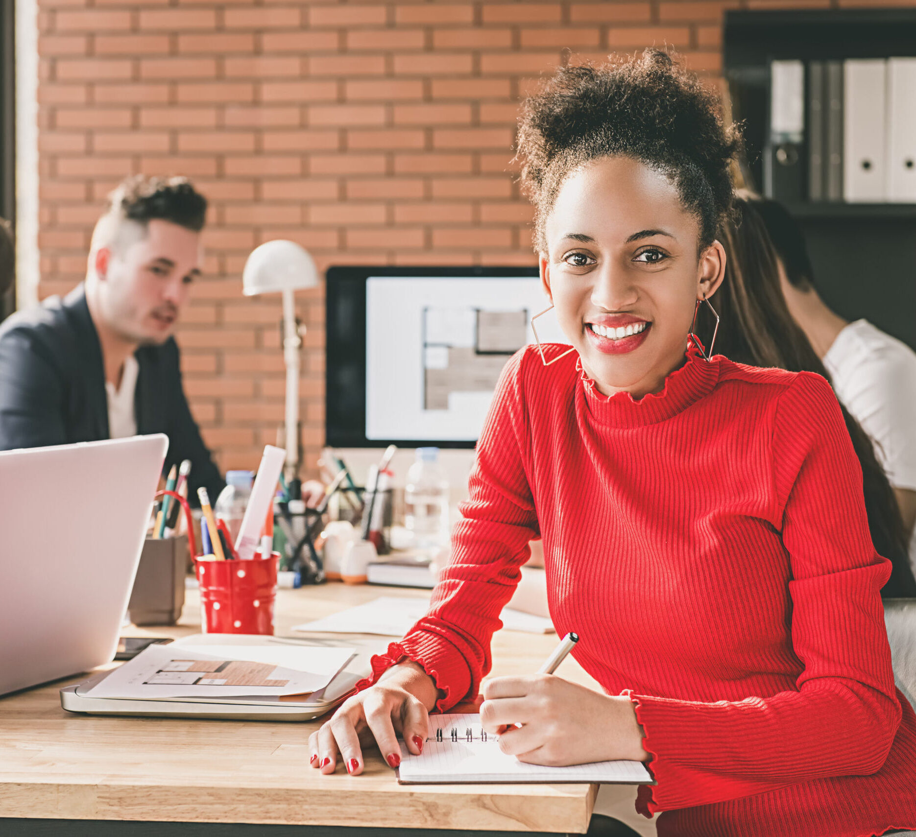 Black businesswoman in office with her colleagues