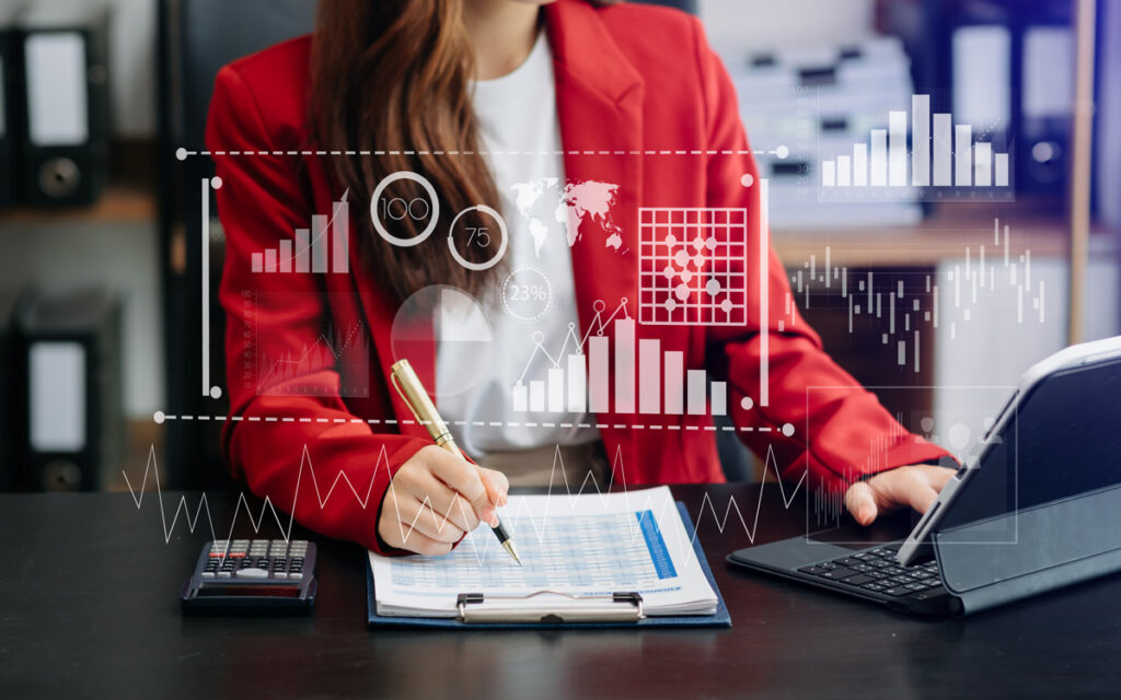 Business analyst reviewing data dashboards and performance charts