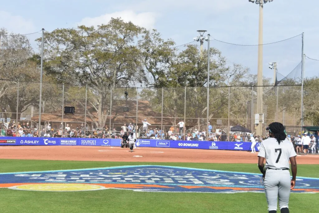 Baseball player walking onto the field during a Shriners charity game