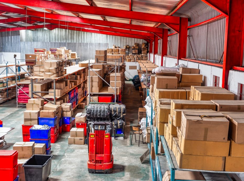 huge warehouse  with carton card and plastic crates boxes in shelfs, high point of view