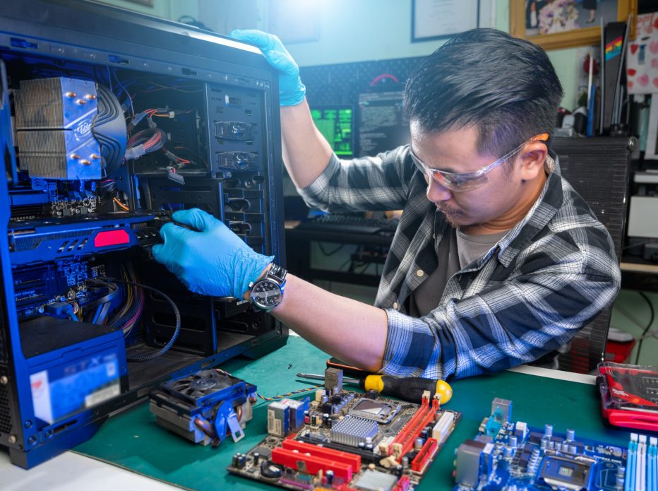 The technician repairing the computer. the concept of computer, CPU, motherboard, hardware, repairing, upgrade and technology.